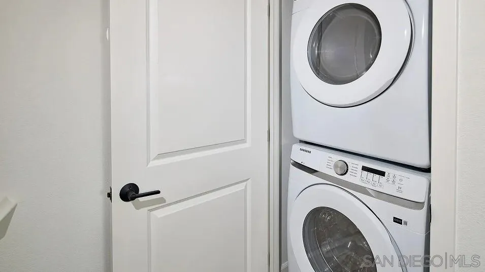 1212 Mountain Laurel Road San Marcos, CA 92078 - Photo 16 of 18 a close view of a utility room with dryer and washer