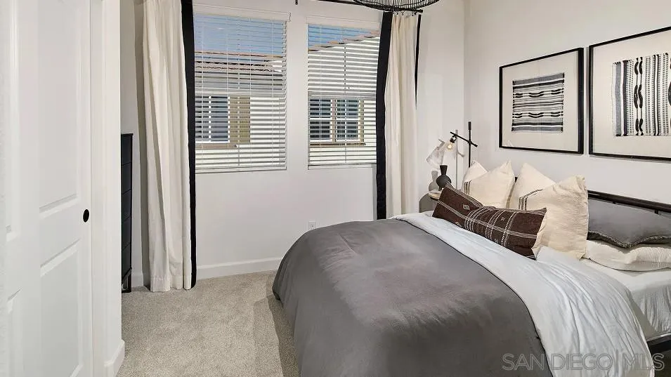 1212 Mountain Laurel Road San Marcos, CA 92078 - Photo 9 of 18 a bedroom with a bed and a large mirror