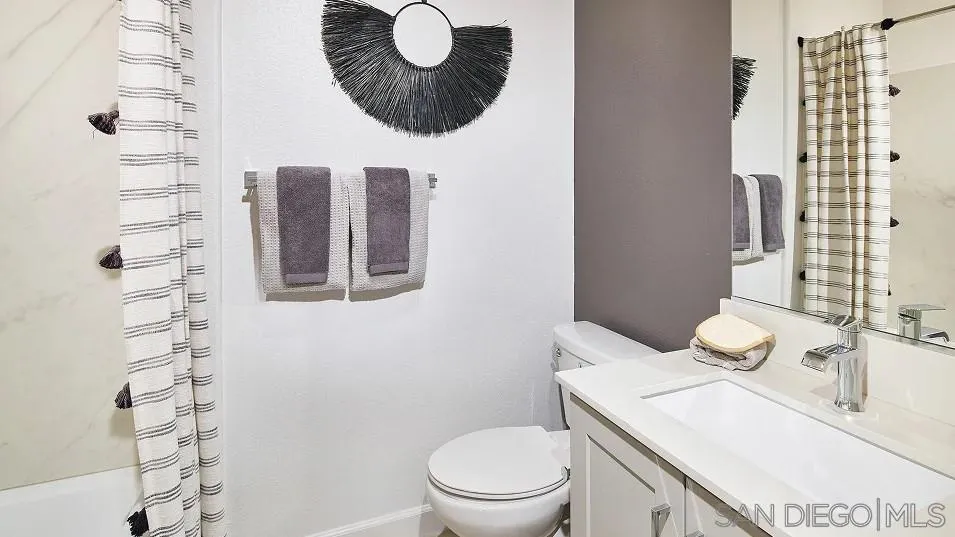 1212 Mountain Laurel Road San Marcos, CA 92078 - Photo 10 of 18 a bathroom with a sink a toilet and shower