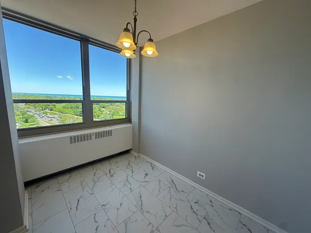 a view of an empty room with a window