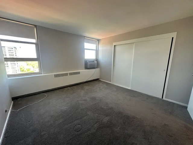 a view of an empty room with a window