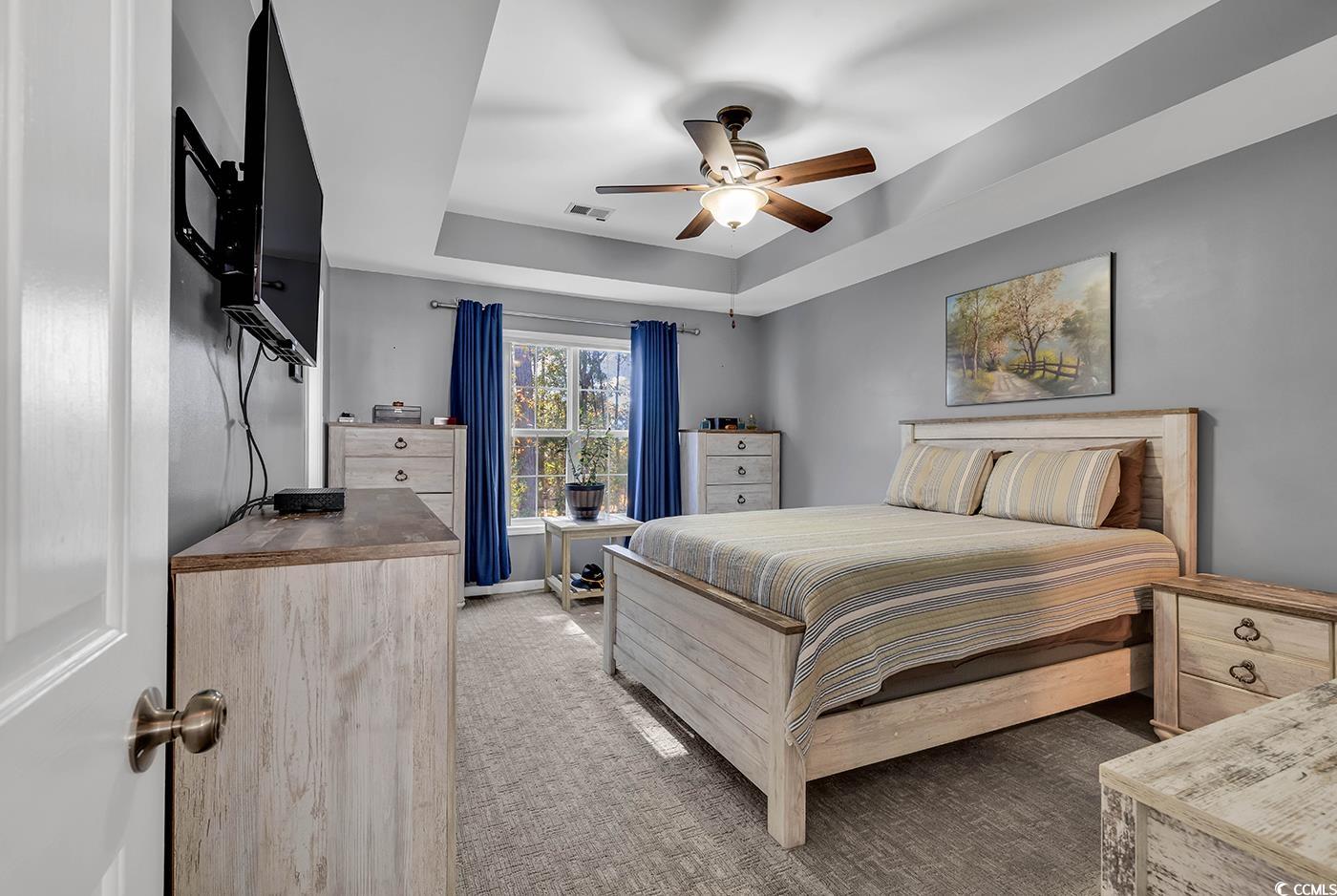 4337 Red Rooster Lane Myrtle Beach, SC 29579 - Photo 20 of 40 Bedroom featuring ceiling fan, a raised ceiling, a