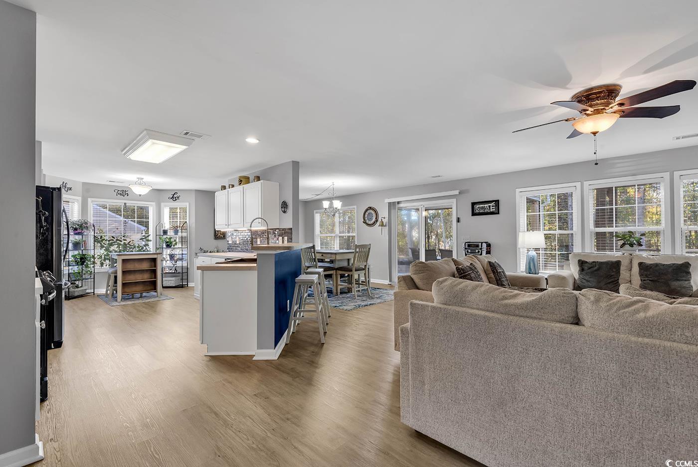 4337 Red Rooster Lane Myrtle Beach, SC 29579 - Photo 8 of 40 Living room with ceiling fan with notable chandeli