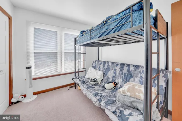 a bed room with furniture and a window