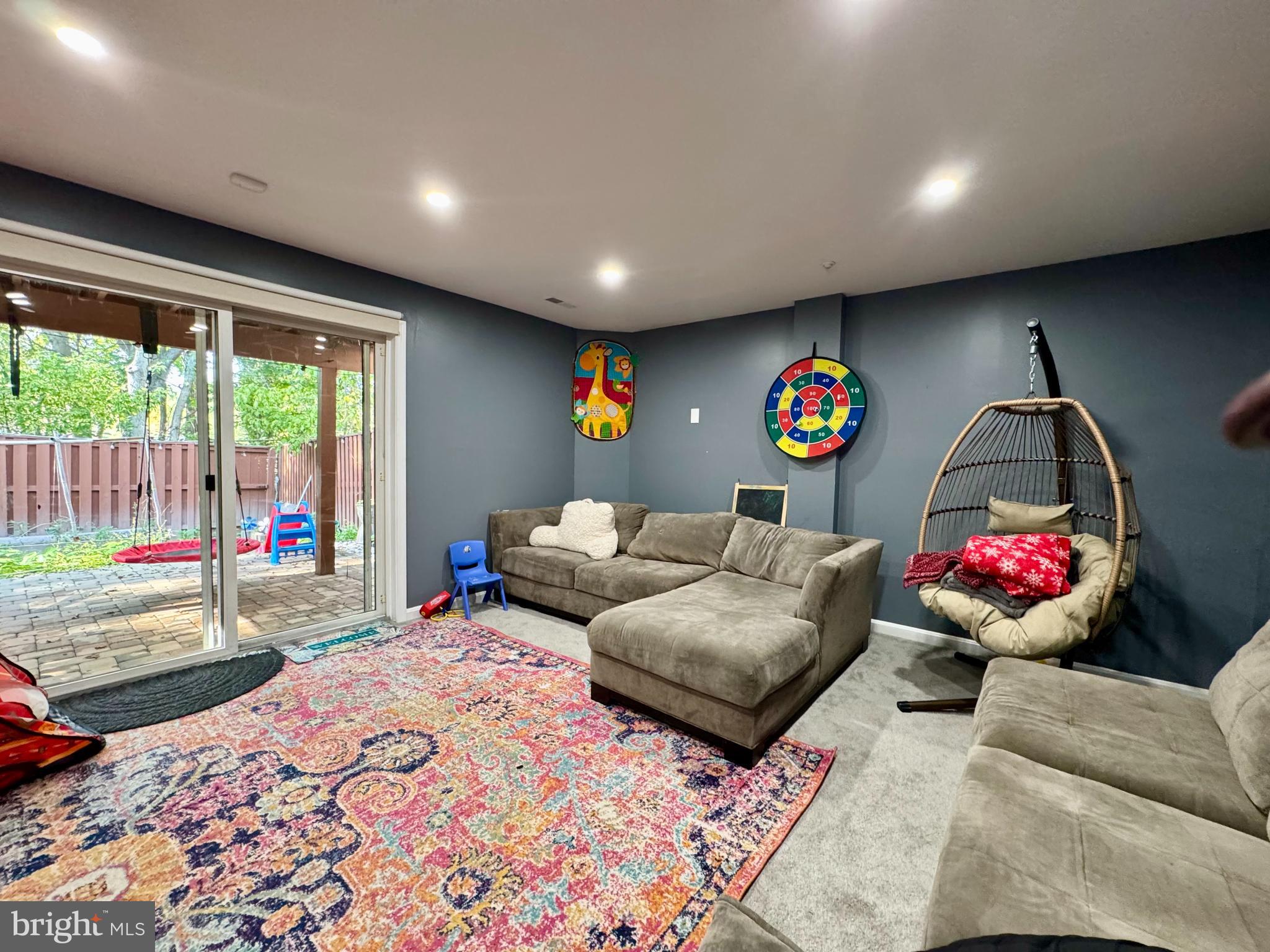 Basement with sliding glass door to the backyard