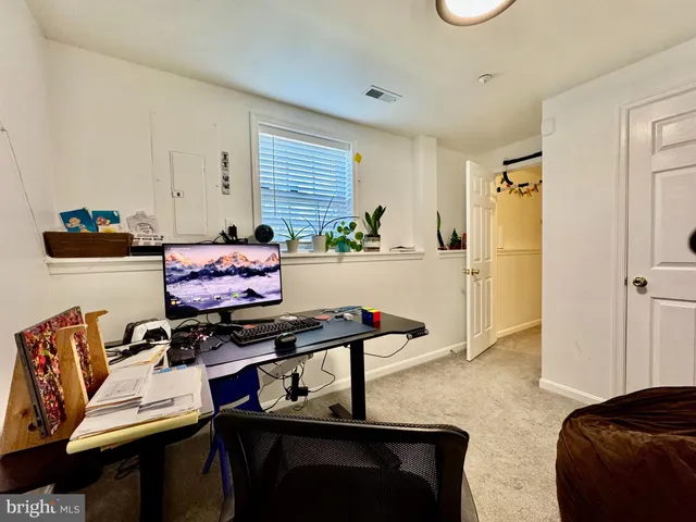 a white toilet sitting next to a bathroom sink