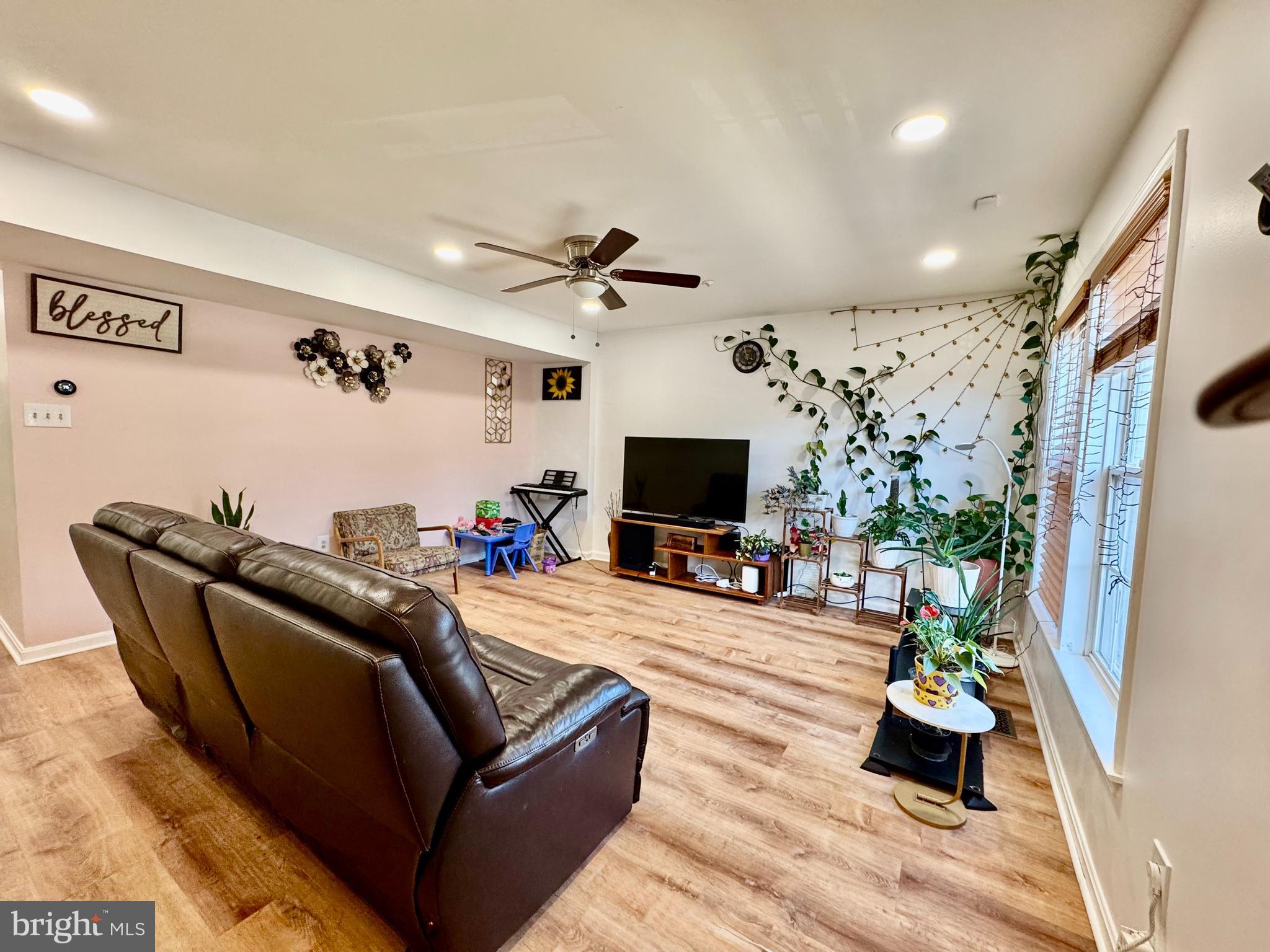 597 Primus Court Frederick, MD 21703 - Photo 3 of 37 Spacious living room with new vinyl flooring