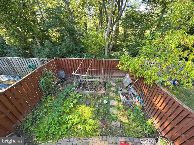 a view of swimming pool with trees and grass