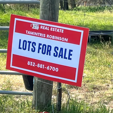 a red sign broad in front of a building