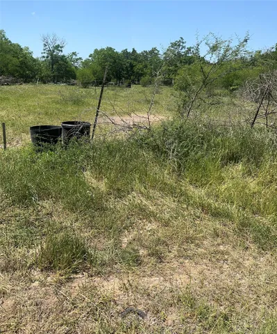 a view of a backyard with a lake view