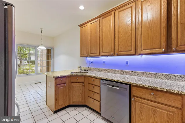 a kitchen with a sink cabinets and window