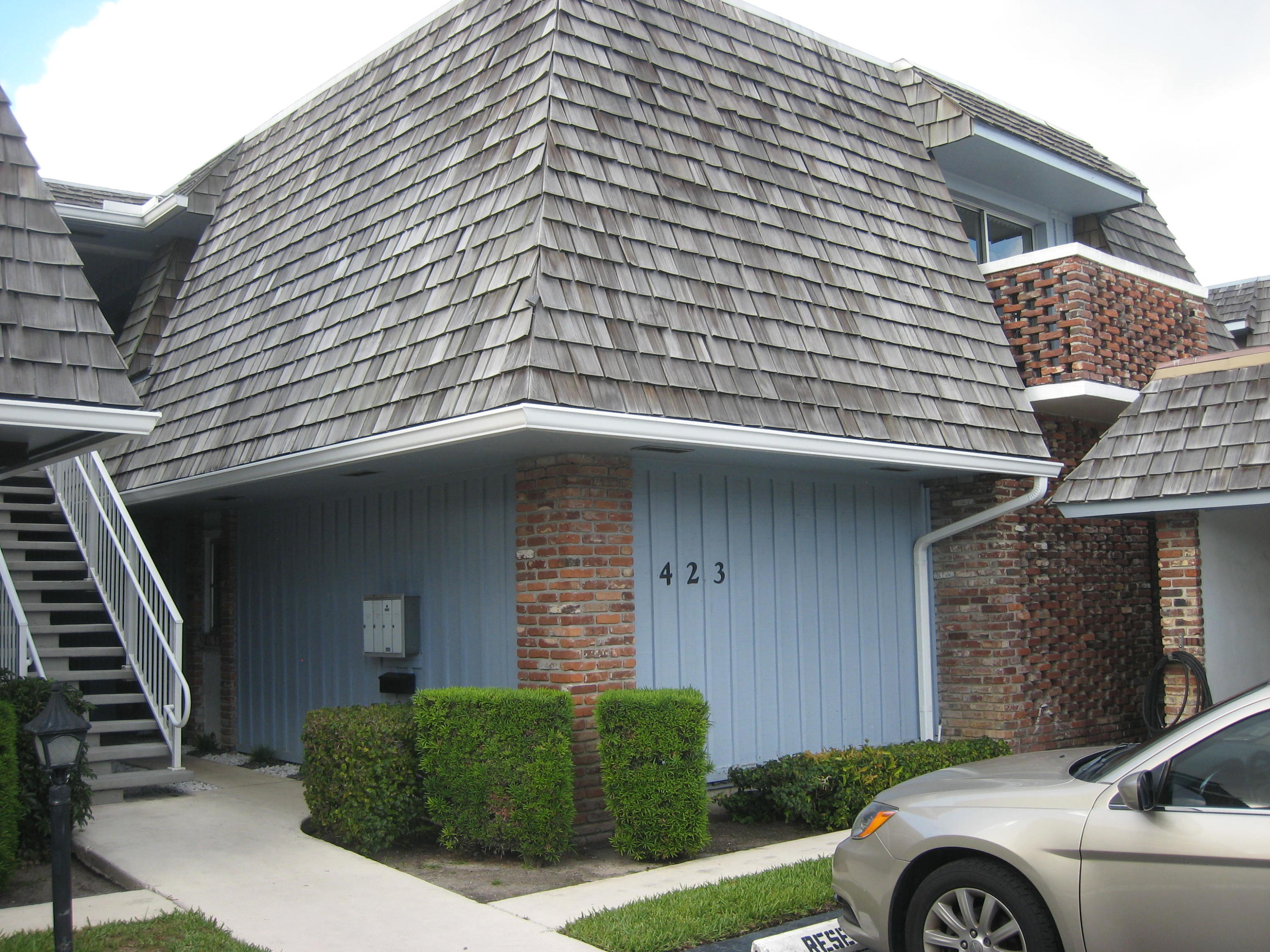 423 Pine Tree Court, Unit 23 Atlantis, FL 33462 - Photo 1 of 32 front