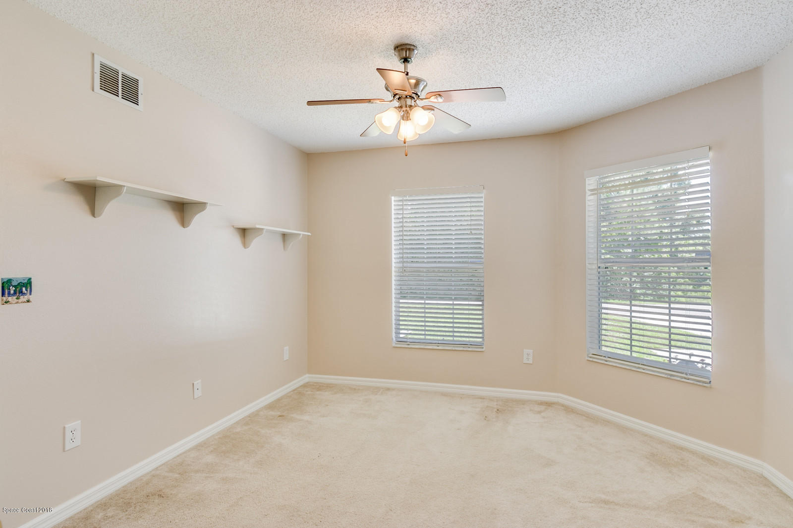 1166 Wabash Road Southeast Palm Bay, FL 32909 - Photo 16 of 27 Second Bedroom has a walk-in closet