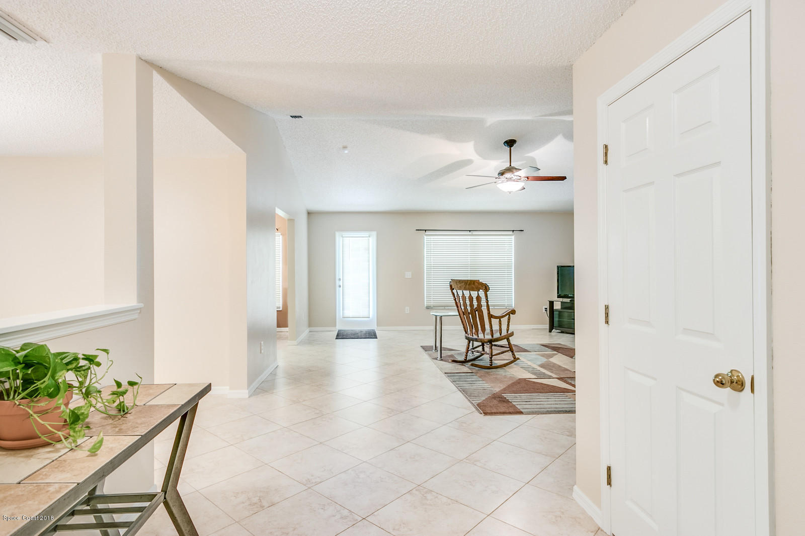 1166 Wabash Road Southeast Palm Bay, FL 32909 - Photo 3 of 27 Foyer Enters To Family Room