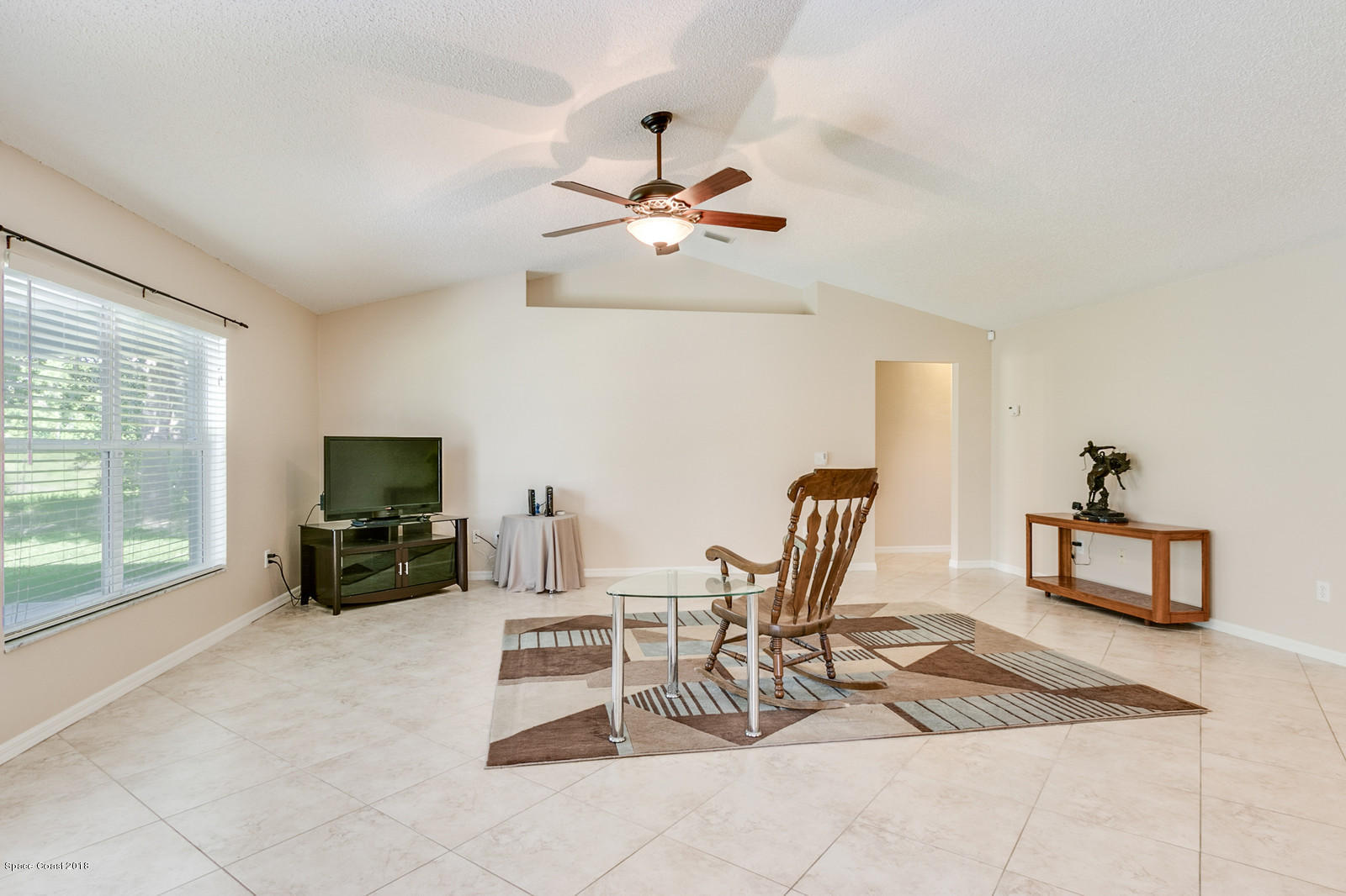 1166 Wabash Road Southeast Palm Bay, FL 32909 - Photo 4 of 27 Large Family Room w/Vaulted Ceiling