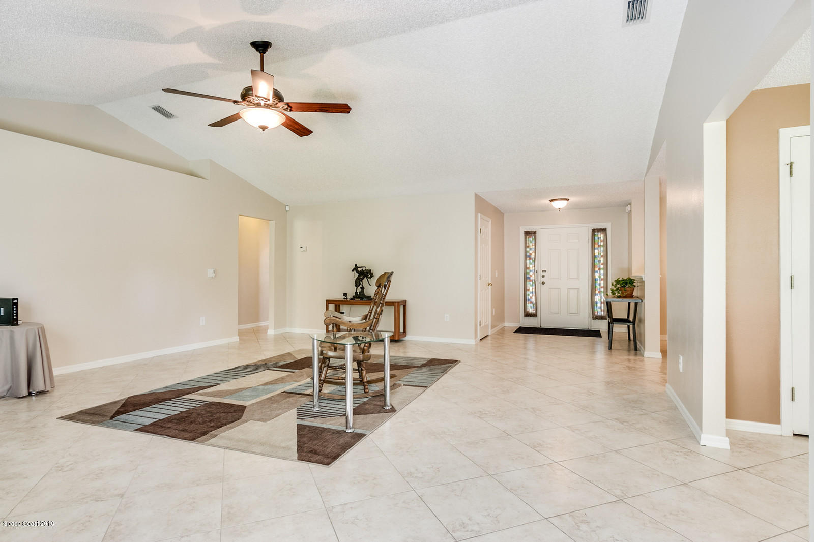 1166 Wabash Road Southeast Palm Bay, FL 32909 - Photo 7 of 27 Tile Floor and Vaulted Ceiling