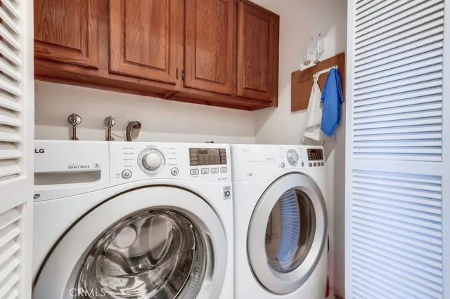 a bedroom with a bed and a potted plant