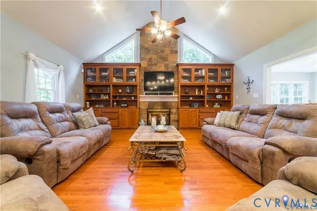 a view of a living room and a kitchen with furniture