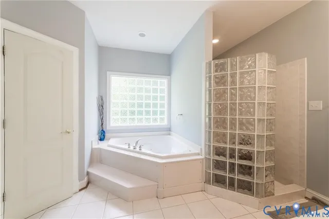 a bathroom with a bathtub and a sink