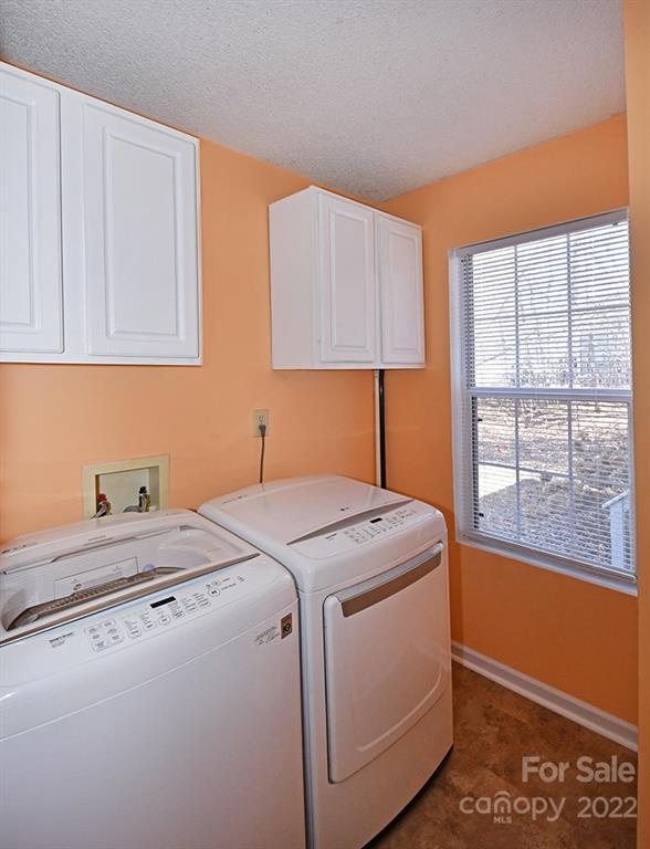 104 Queensbury Road Troutman, NC 28166 - Photo 12 of 24 a utility room with dryer and washer