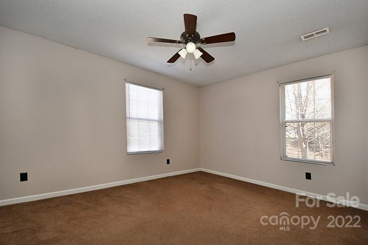 104 Queensbury Road Troutman, NC 28166 - Photo 15 of 24 a view of an empty room with a window
