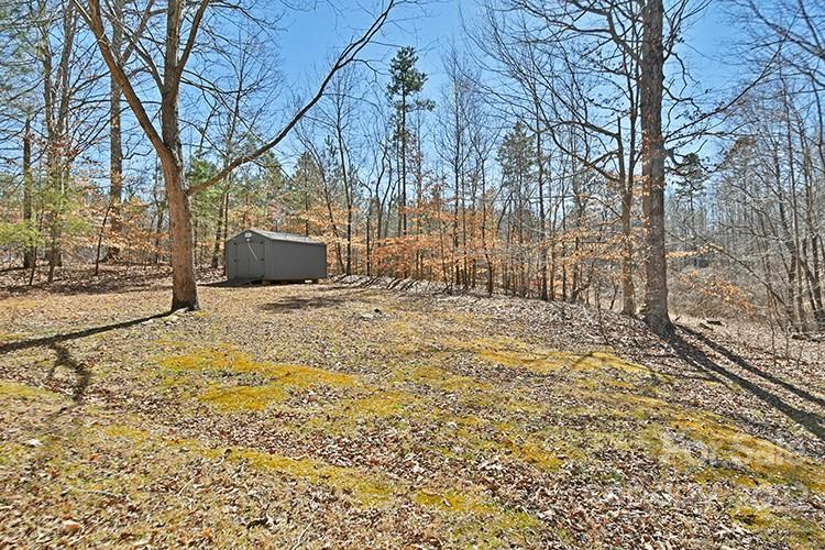 104 Queensbury Road Troutman, NC 28166 - Photo 17 of 24 a view of a yard with wooden fence