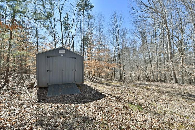 104 Queensbury Road Troutman, NC 28166 - Photo 19 of 24 a view of a house with a yard