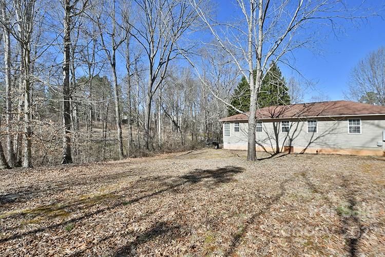 104 Queensbury Road Troutman, NC 28166 - Photo 23 of 24 a view of a backyard of the house