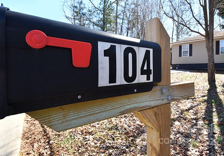 104 Queensbury Road Troutman, NC 28166 - Photo 24 of 24 a sign that is on the side of a building