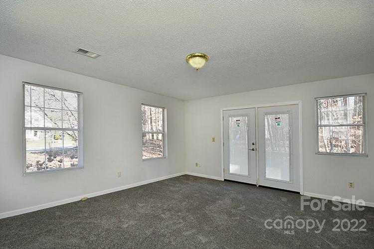 104 Queensbury Road Troutman, NC 28166 - Photo 7 of 24 a view of an empty room with a window