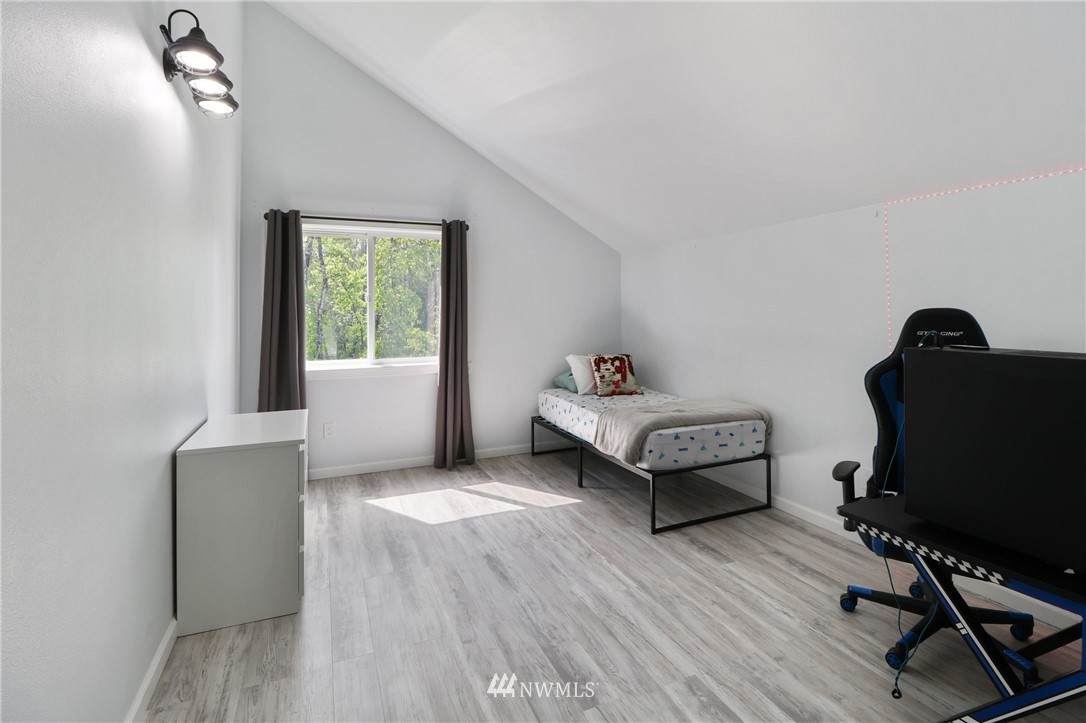 706 2nd Street Steilacoom, WA 98388 - Photo 16 of 35 a bedroom with furniture and a window