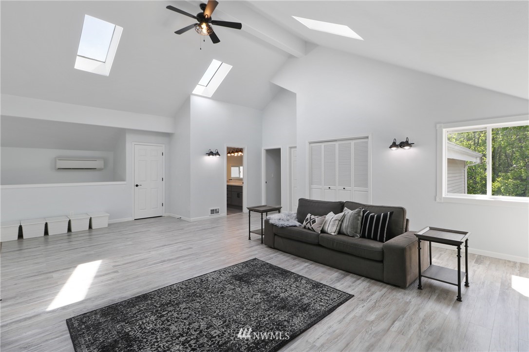 706 2nd Street Steilacoom, WA 98388 - Photo 20 of 35 a living room with furniture and a rug