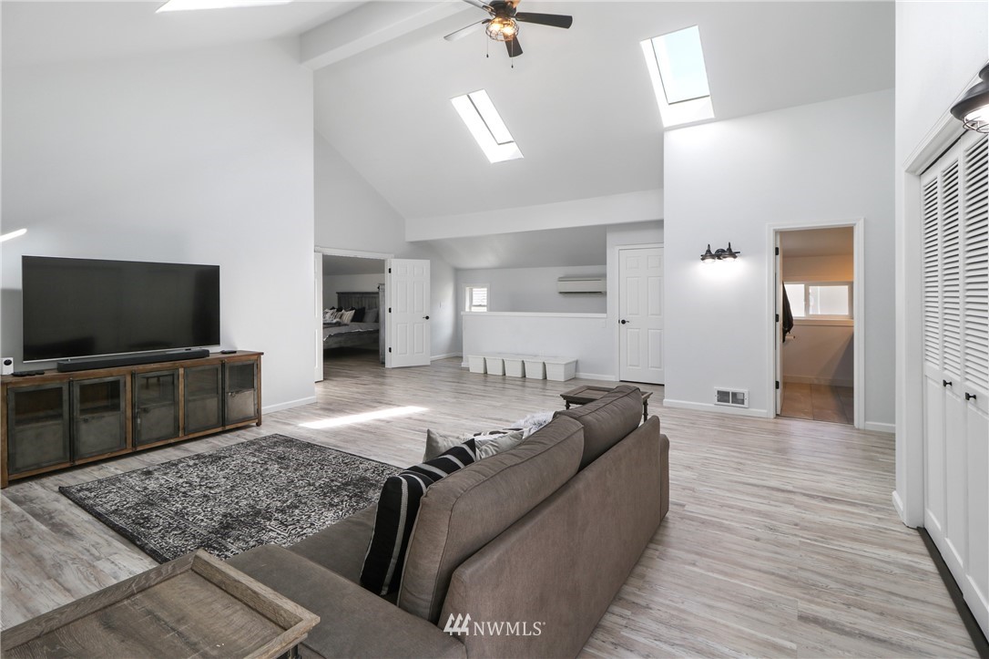706 2nd Street Steilacoom, WA 98388 - Photo 22 of 35 a living room with furniture and a flat screen tv