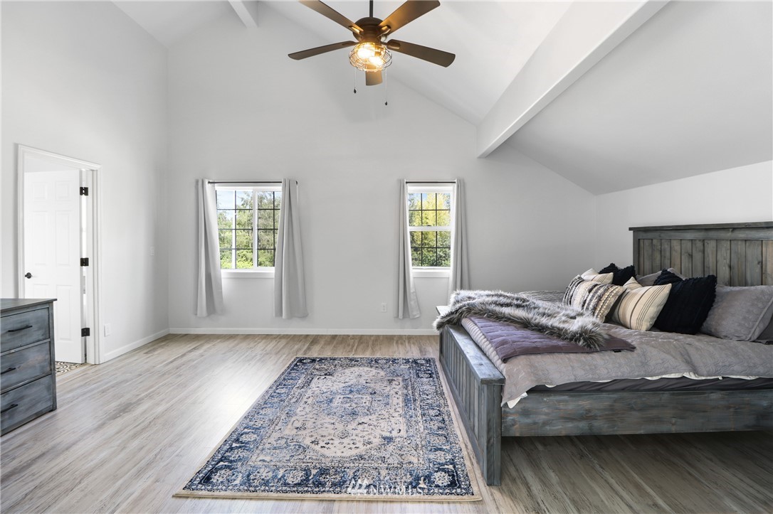 706 2nd Street Steilacoom, WA 98388 - Photo 25 of 35 a bedroom with a bed and window