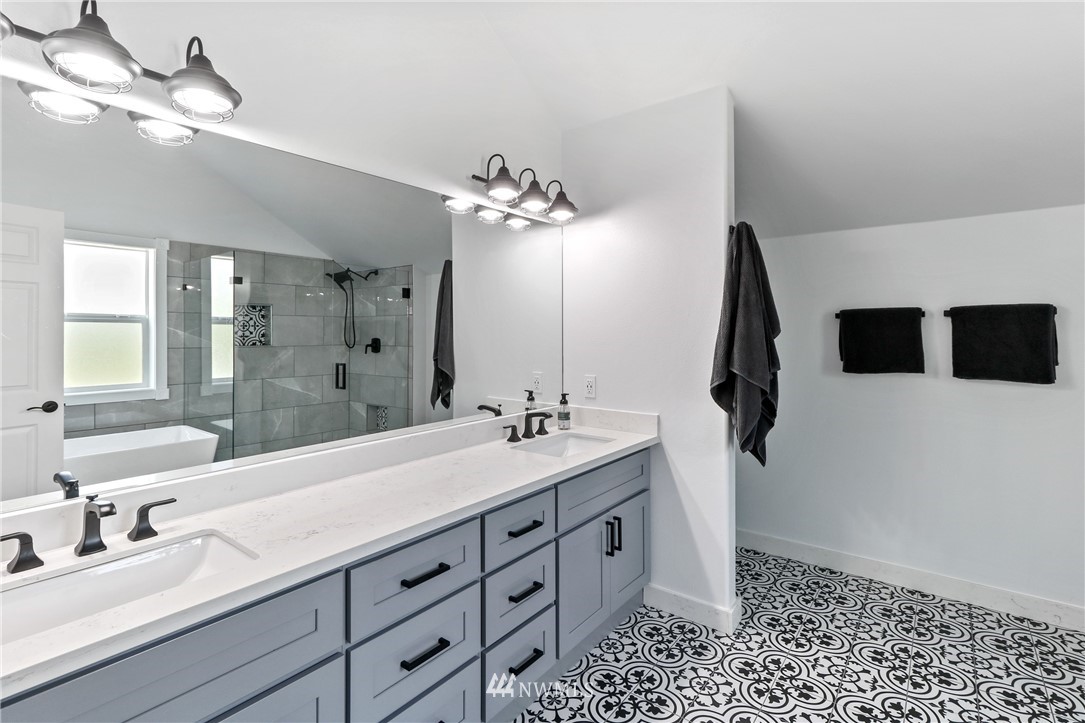 706 2nd Street Steilacoom, WA 98388 - Photo 27 of 35 a bathroom with a double vanity sink and a mirror