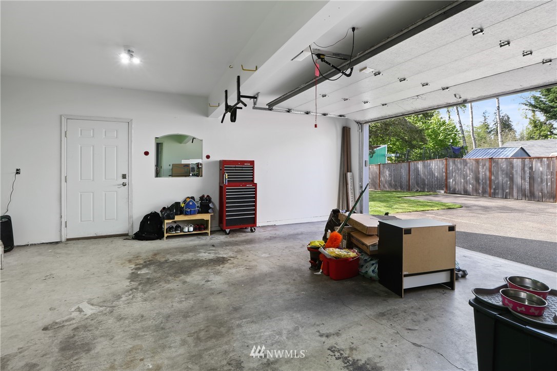 706 2nd Street Steilacoom, WA 98388 - Photo 30 of 35 a room with furniture and a large window