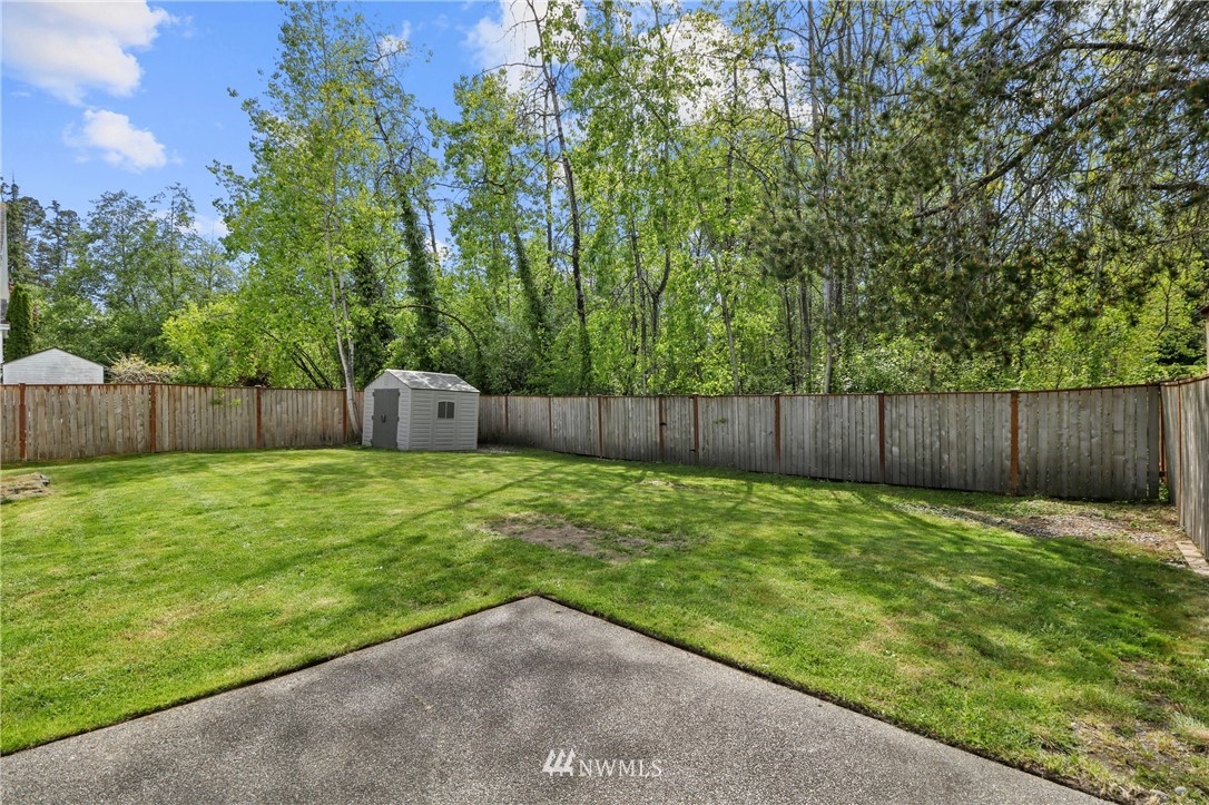 706 2nd Street Steilacoom, WA 98388 - Photo 35 of 35 a backyard of a house with lots of green space