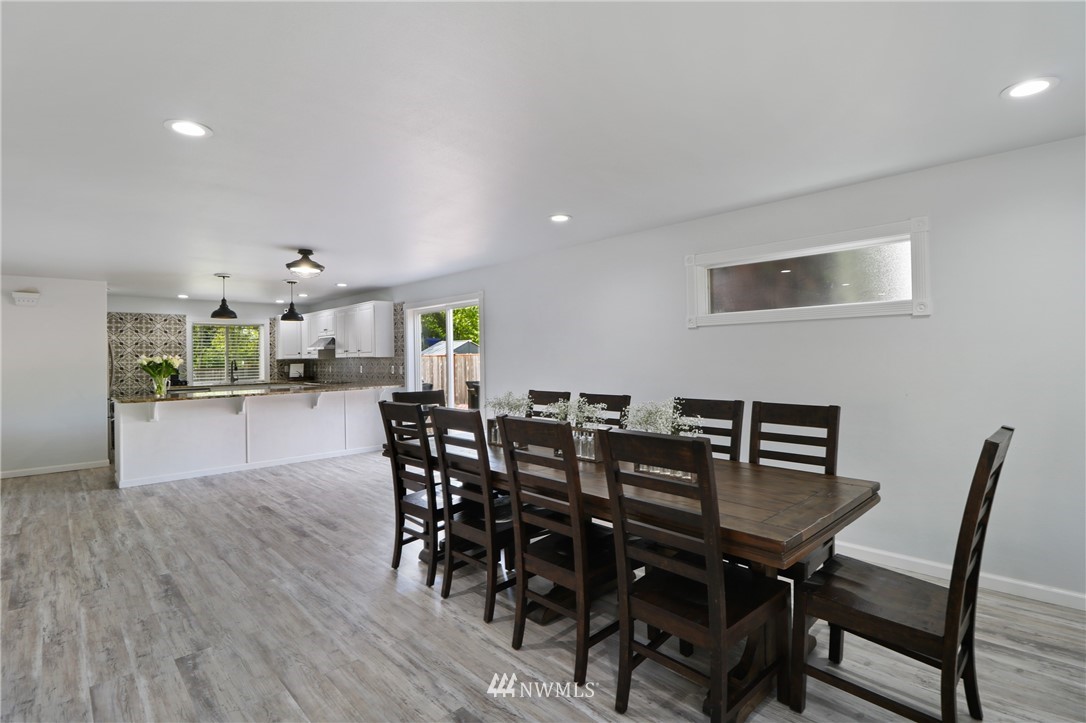 706 2nd Street Steilacoom, WA 98388 - Photo 9 of 35 a view of a dining room with furniture and wooden floor