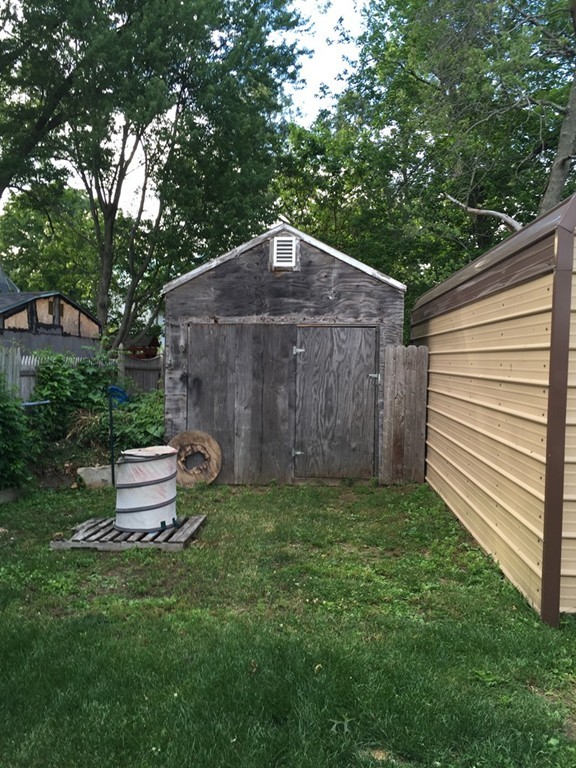 80 Temby Street Springfield, MA 01119 - Photo 30 of 30 a backyard of a house with a small garden