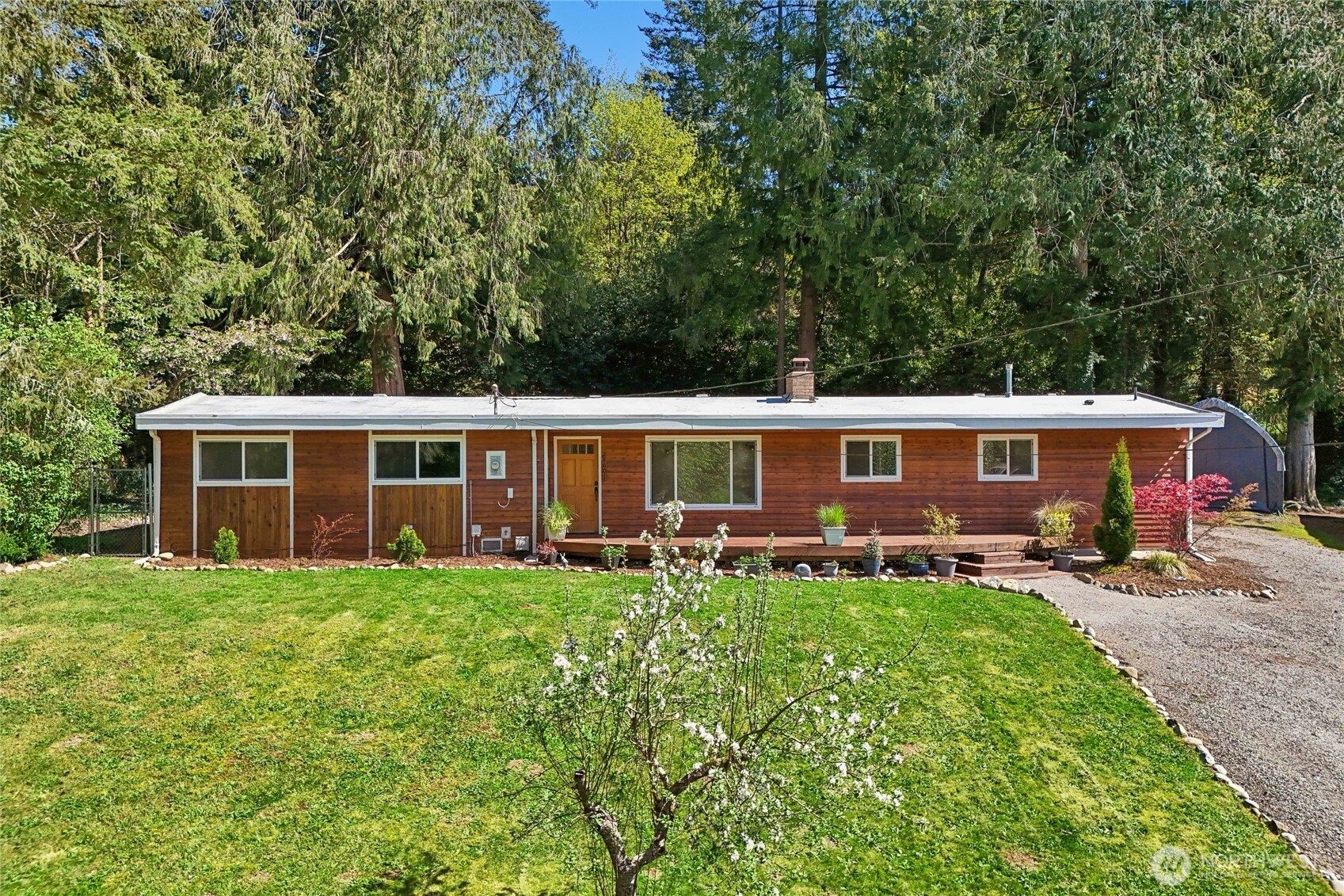 28601 Southeast 225th Street Maple Valley, WA 98038 - Photo 2 of 40 a front view of a house with garden