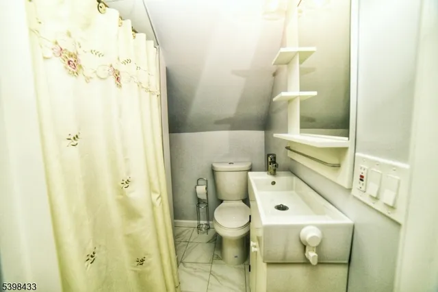 a bathroom with a sink and toilet