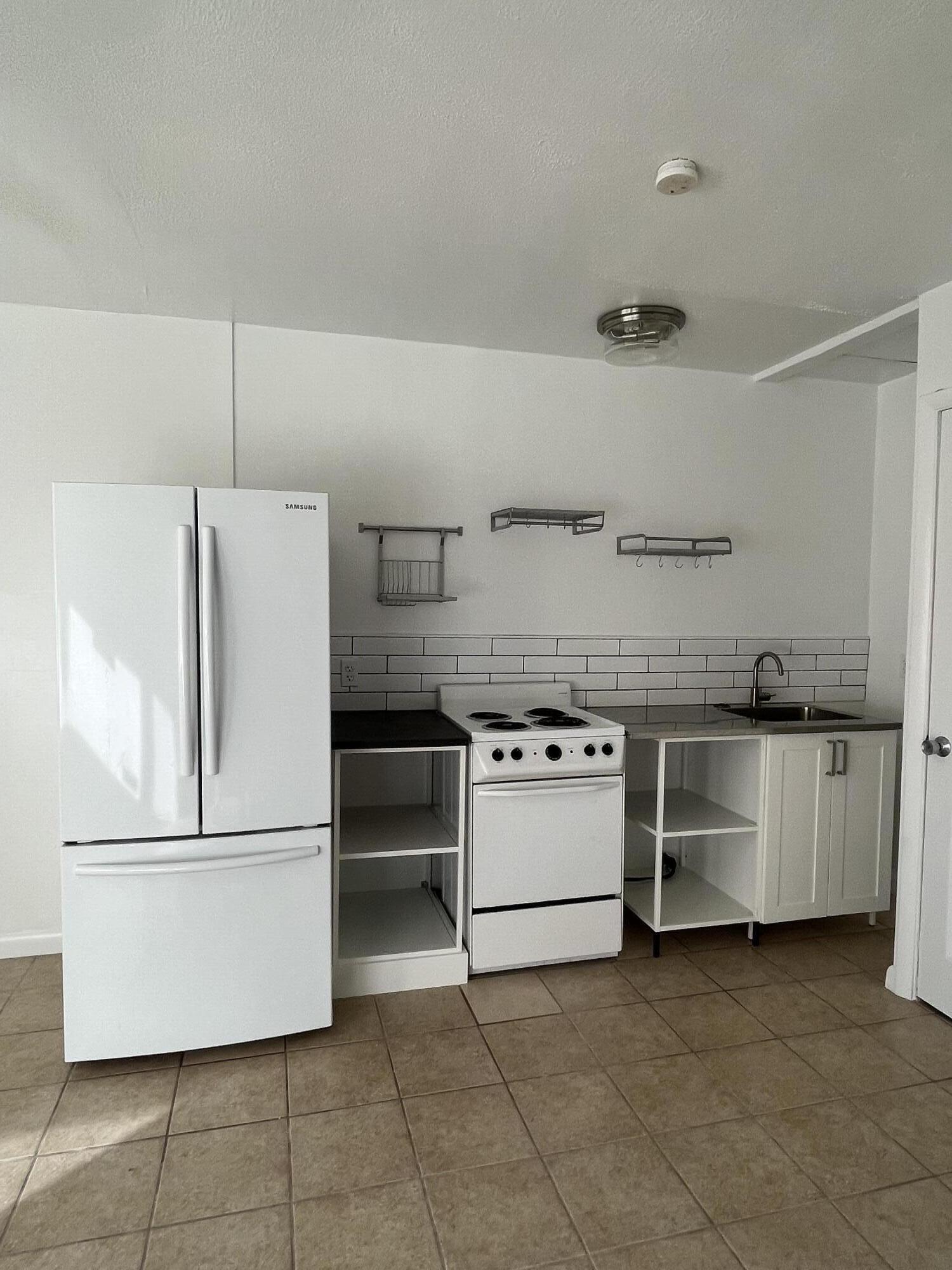 320 West Blue Heron Boulevard, Unit 2 Riviera Beach, FL 33404 - Photo 1 of 7 IMG_3462