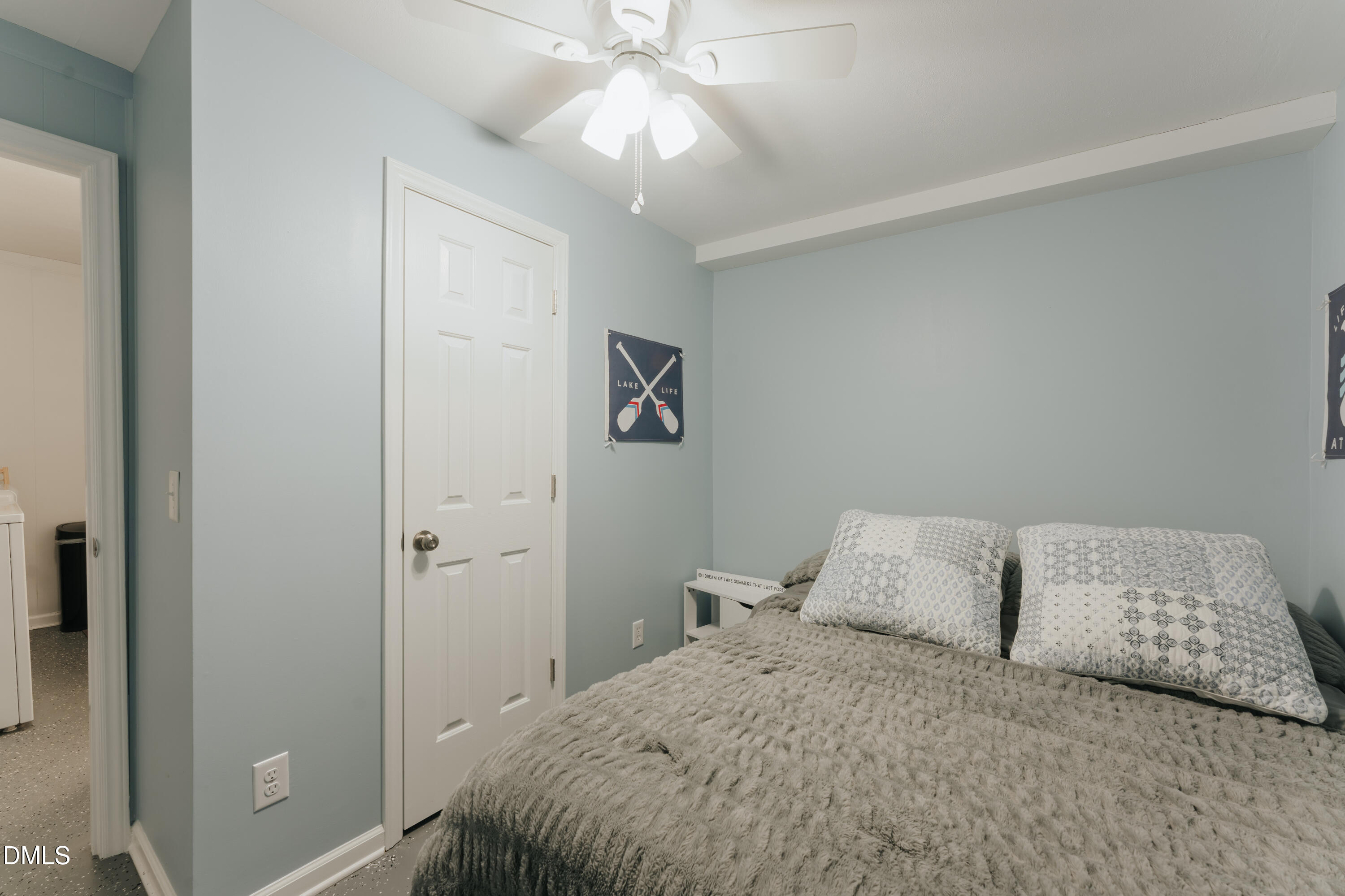 288 Bunny Rabbit Road Leasburg, NC 27291 - Photo 49 of 74 a bedroom with a bed and a chandelier