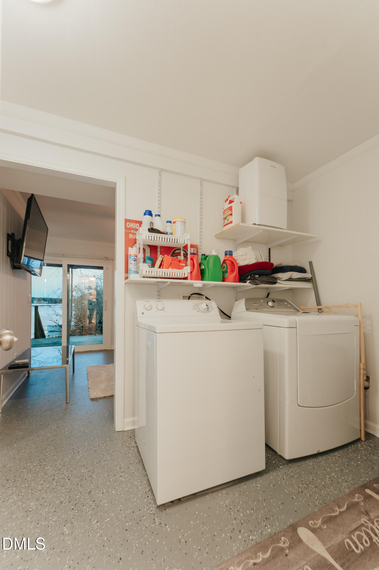 288 Bunny Rabbit Road Leasburg, NC 27291 - Photo 54 of 74 a utility room with cabinets dryer and washer