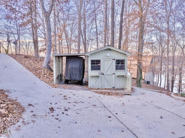 288 Bunny Rabbit Road Leasburg, NC 27291 - Photo 59 of 74 a front view of a house with a yard and garage