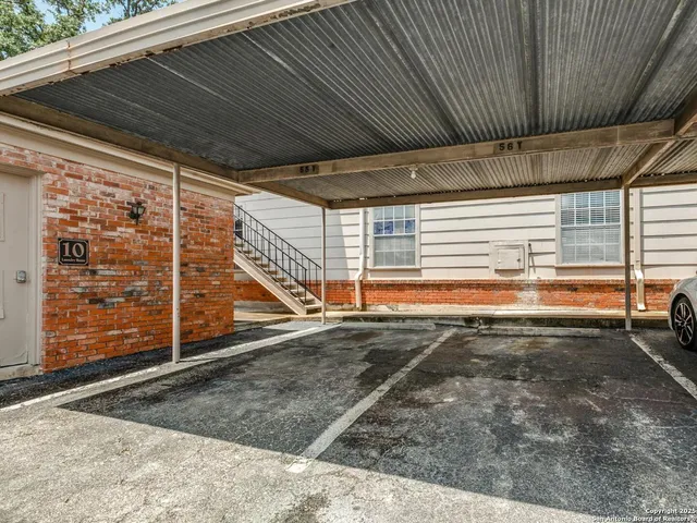 a view of a room with wooden walls