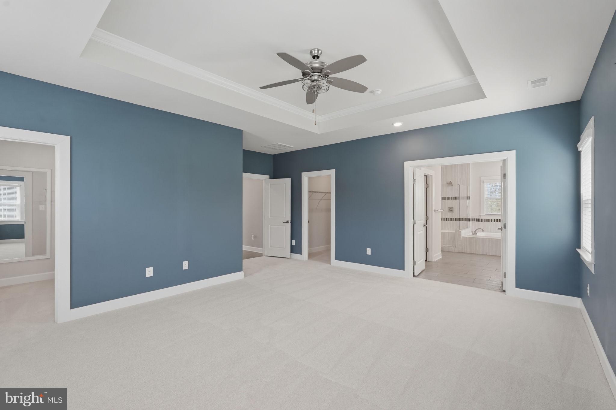 23648 Amesfield Place Aldie, VA 20105 - Photo 19 of 41 a view of a livingroom with a ceiling fan and window