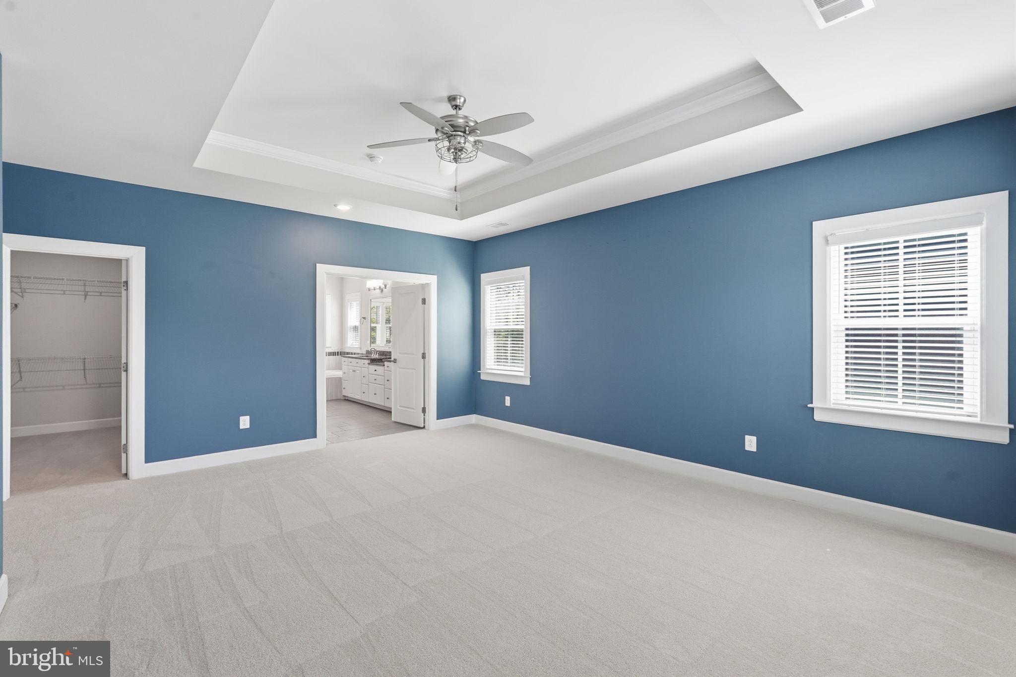 23648 Amesfield Place Aldie, VA 20105 - Photo 20 of 41 a view of a big room with windows and chandelier fan