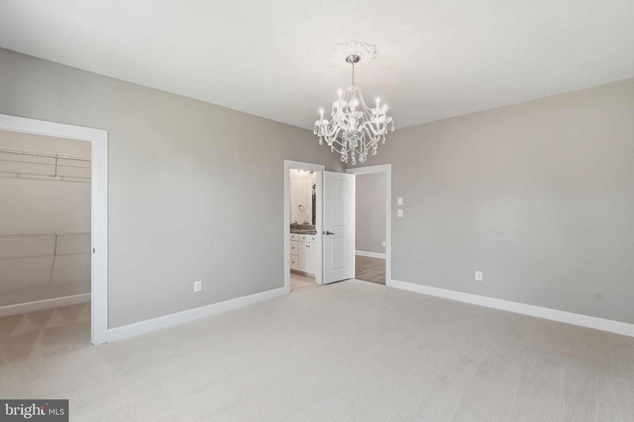 23648 Amesfield Place Aldie, VA 20105 - Photo 25 of 41 a view of a chandelier and window in a room