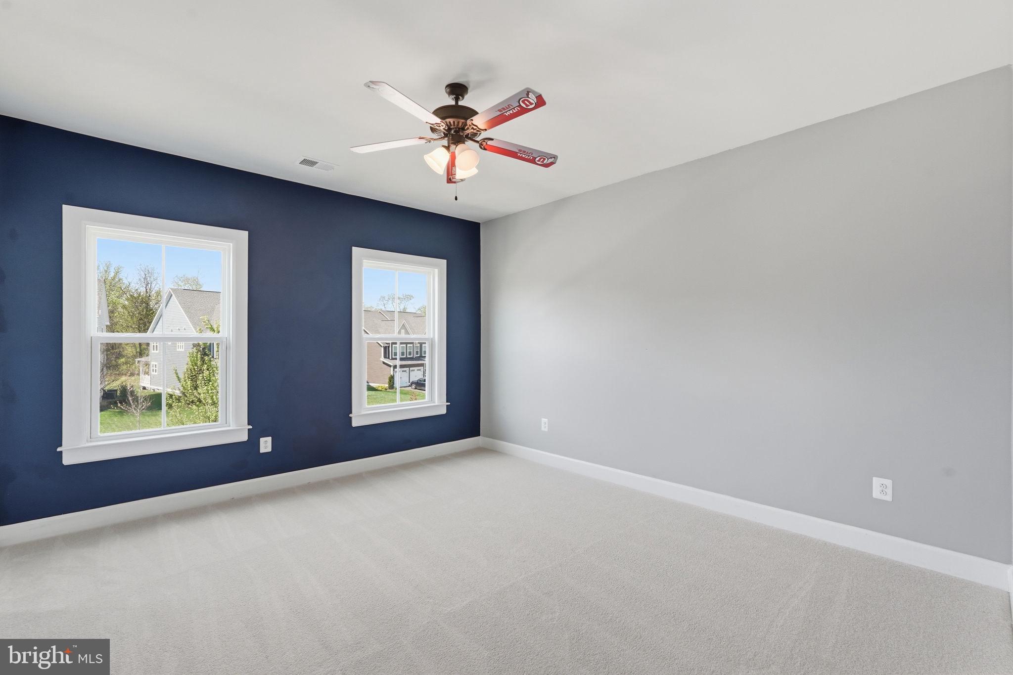 23648 Amesfield Place Aldie, VA 20105 - Photo 26 of 41 an empty room with windows and chandelier fan